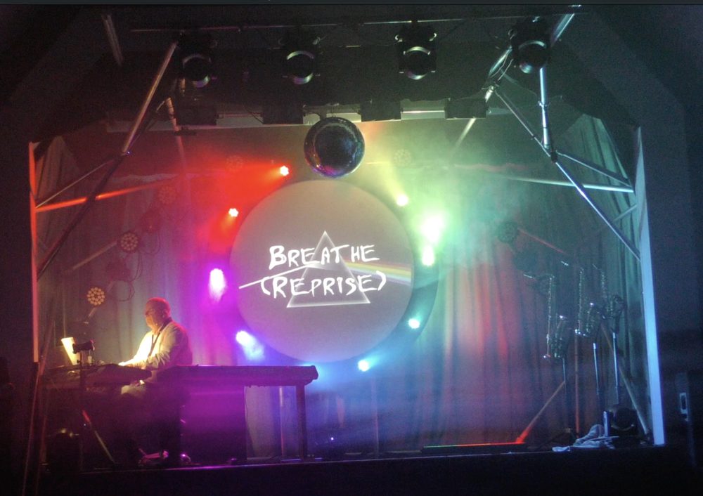 Breathe (Reprise) — title card on the circular projection screen